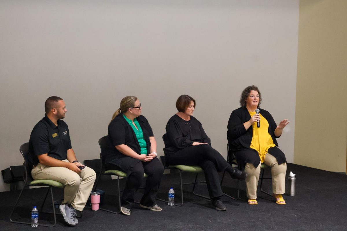 Shauna Reilly (far right) answers a question from Collin Jarrell (far left). Panelists Stacie Jankowski (center left) and Annie Hammock (center right) listen for her response.