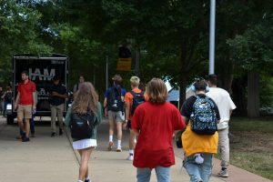 Students walk across campus.