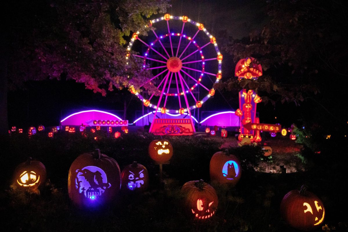 A pumpkin Ferris wheel overlooks the event.