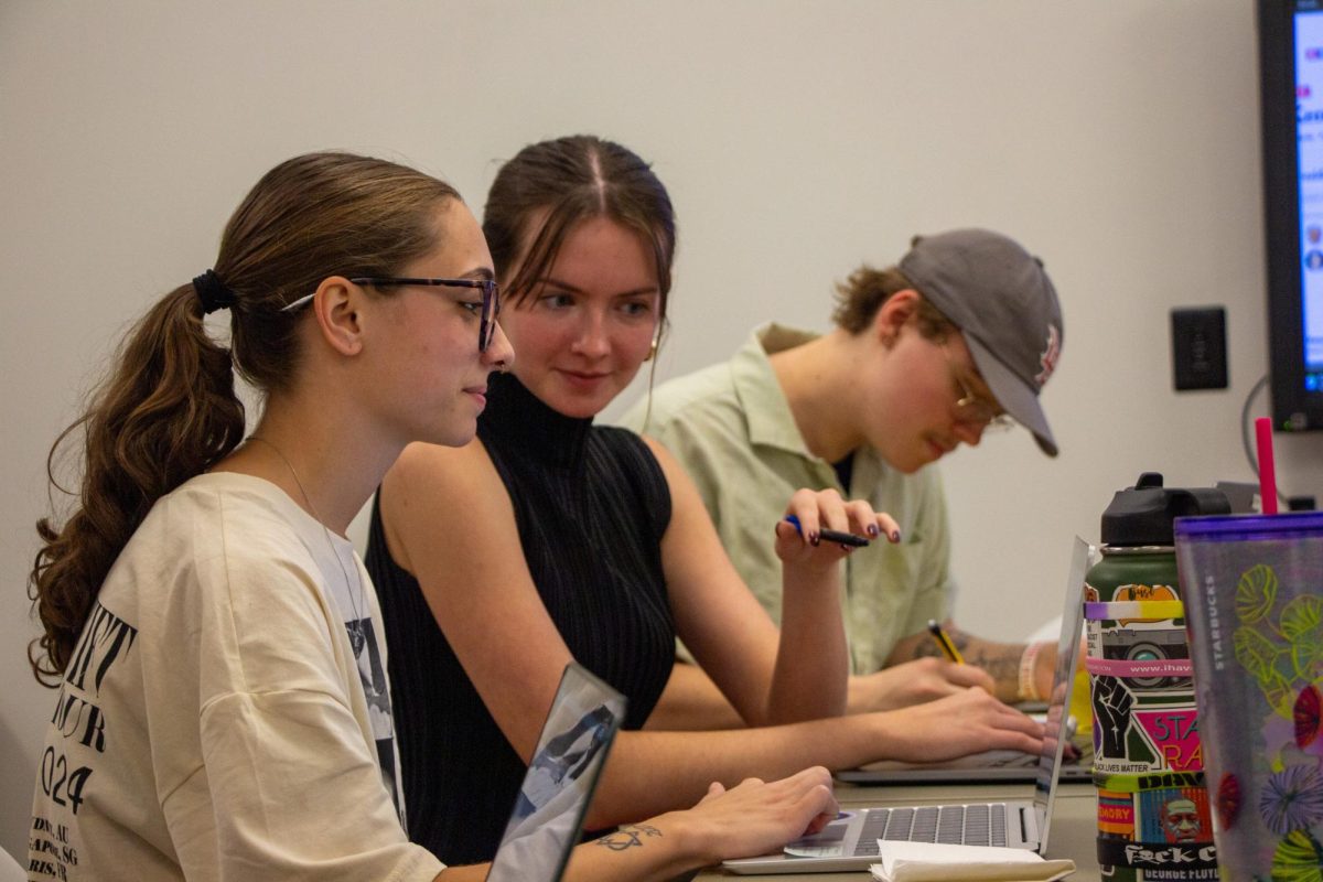 News Editor Shae Meade (left), Editor-in-Chief Emily Sisk (middle) and Assistant News Editor Henry Crawford (right) work on election updates in Griffin Hall.