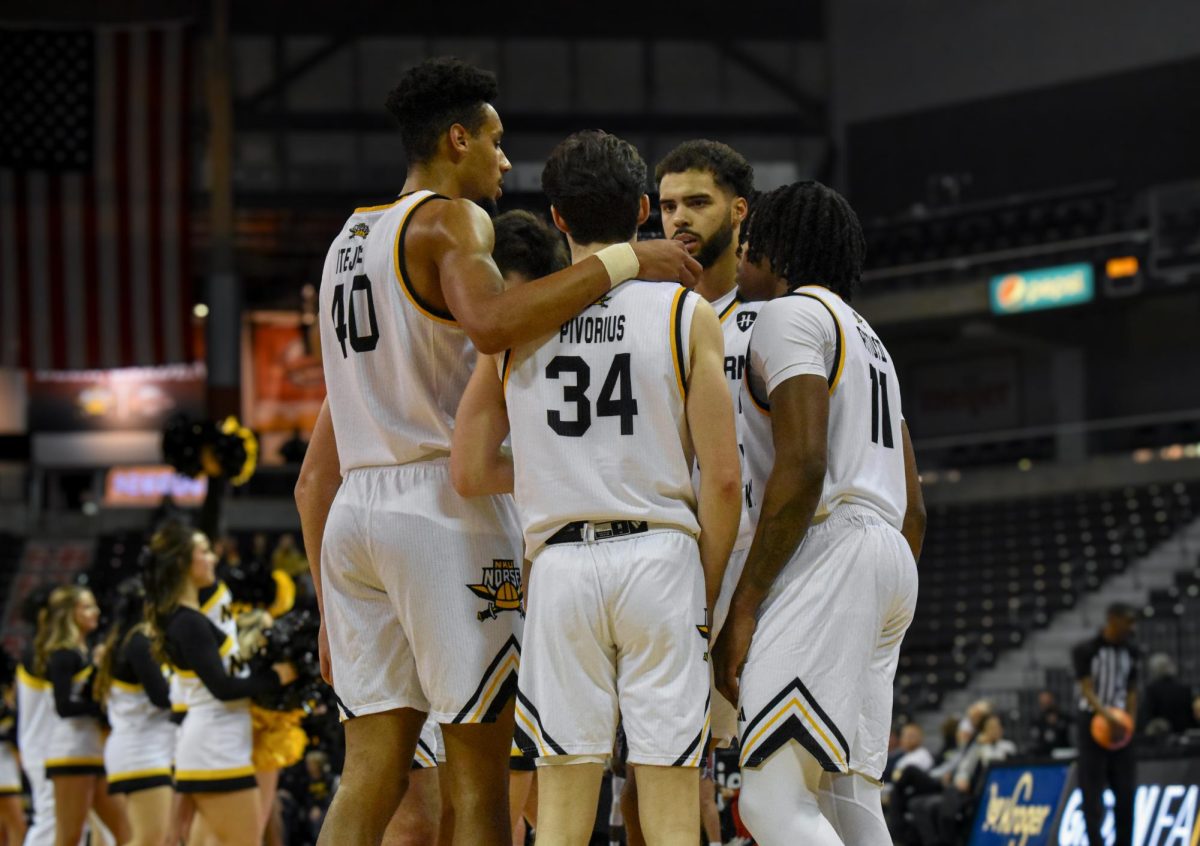 The Norse huddled during a break in the action. 