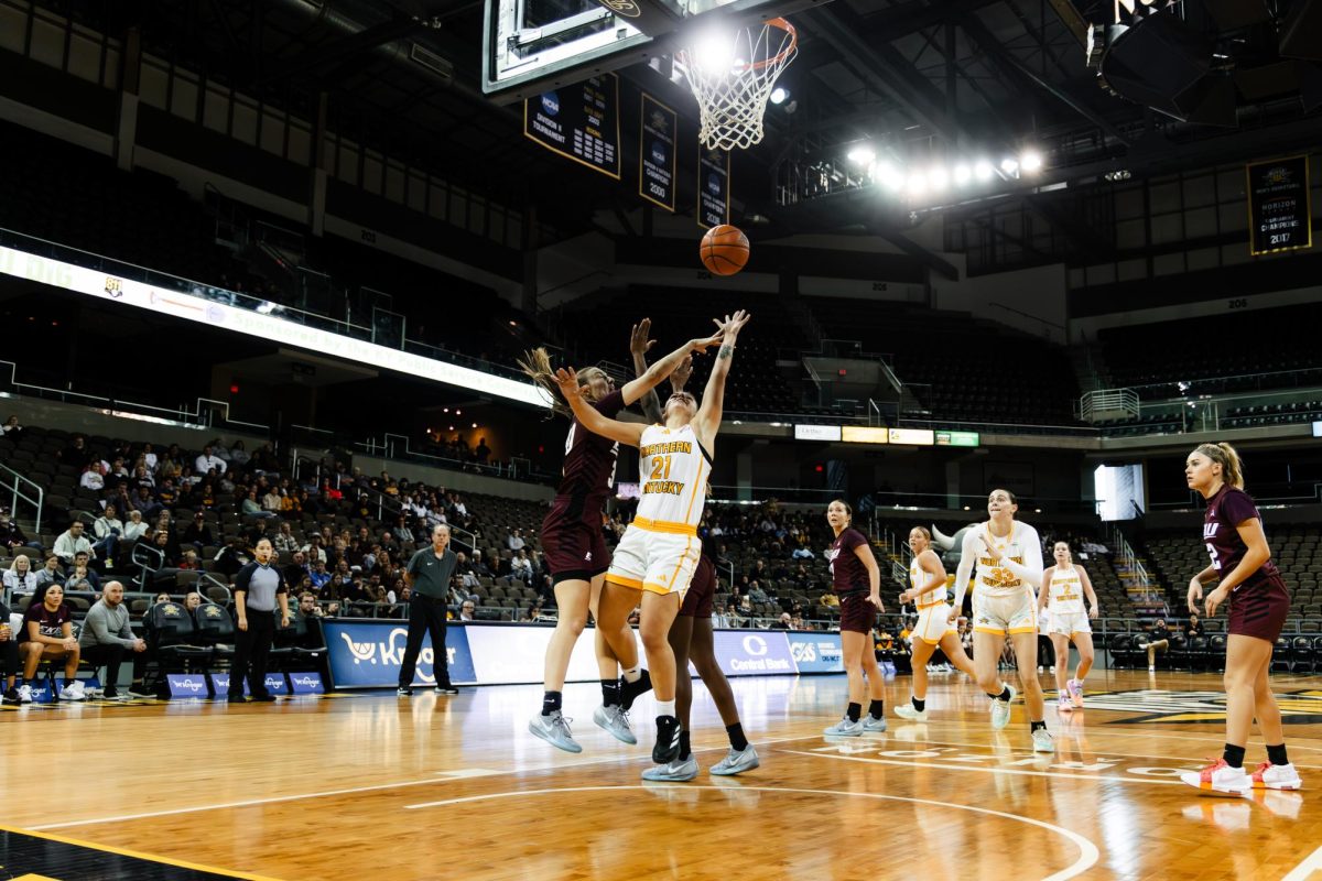 Jaci Jones drives to the basket for a contested score through traffic.