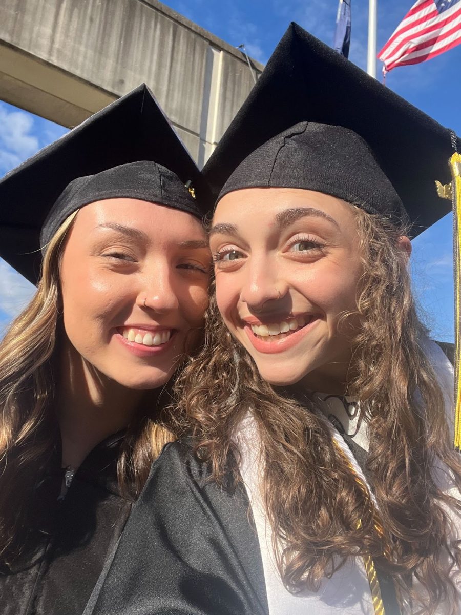 Roden and Shae Meade smile at graduation on Dec. 14.