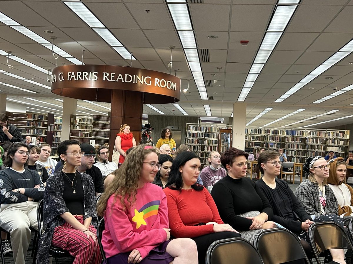 Students listening intently to a literary reading. 