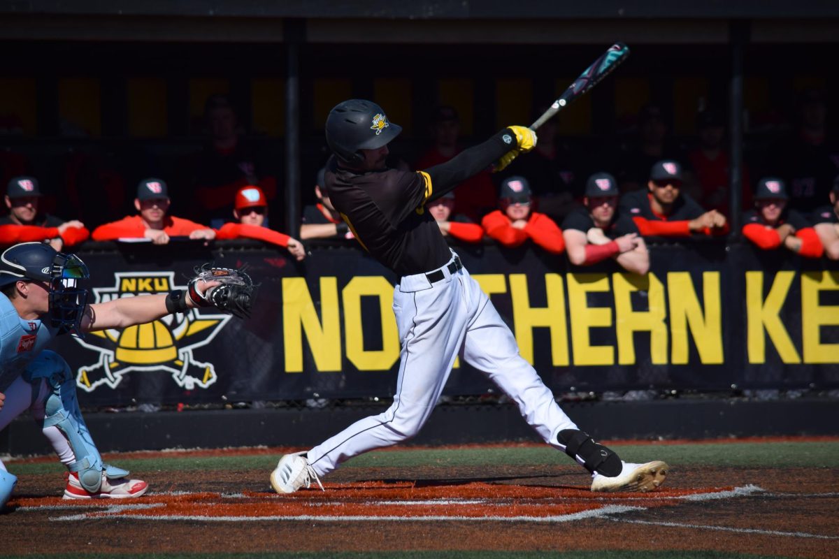 Nolan Sparks hitting a line drive into the outfield.