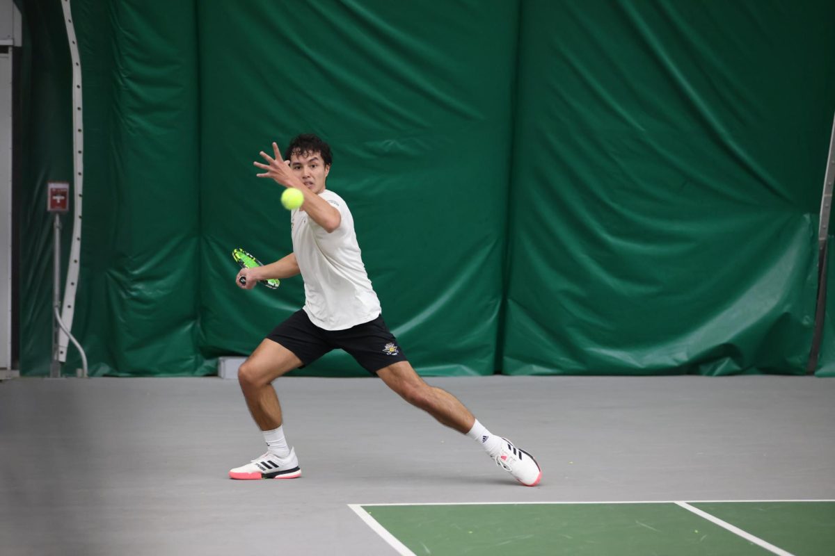  NKU’s Jacob Rouleau-Mailly getting ready to hit the ball. He kept it close with CSU’s Lincoln Battle but lost both sets 7-5 and 6-4.
