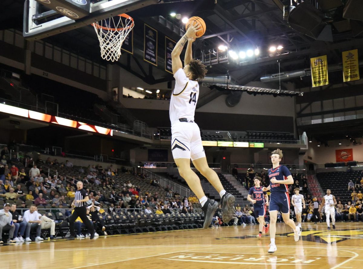 Jeramiah Israel (14) dunks the basketball during the final home game of the 2024-25 season. NKU defeated Detroit Mercy 99-75 in the first round of the Horizon League tournament.