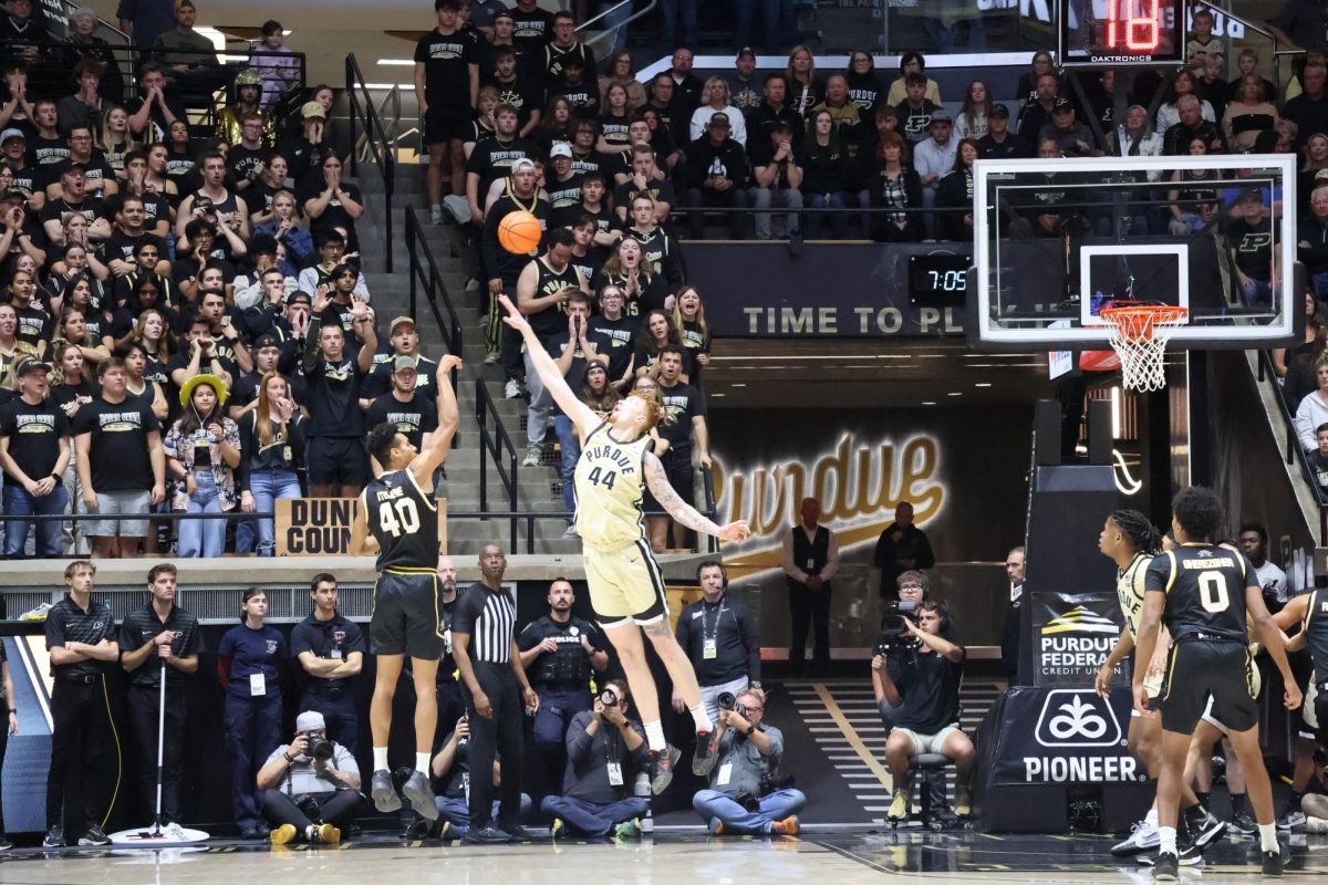 Itejere shot the ball over Purdue's big Will Berg. He finished this game with eight points.